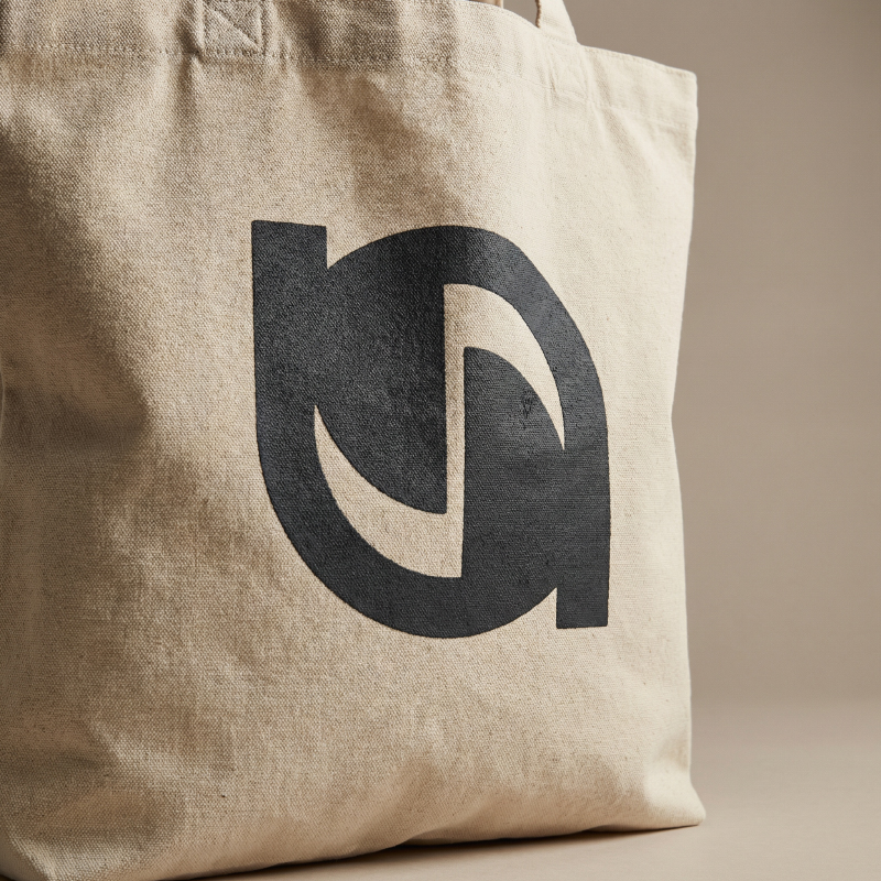 Screen-printing-logo-detail-on-custom-canvas-tote-bag-showing-ink-adhesion-and-solid-color-durability
