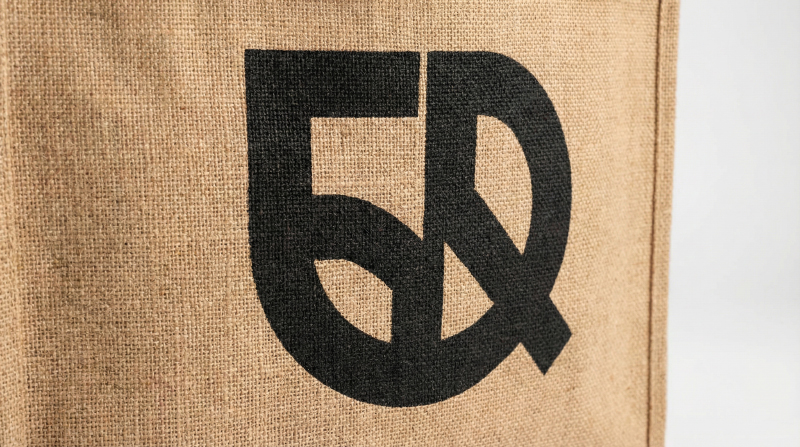 Screen-printed-logo-on-jute-tote-bag-with-bold-color-detail