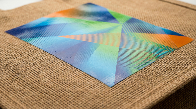 Heat-transfer-printed-logo-on-jute-tote-bag-with-detailed-graphics